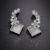 crystal bloom square drop earrings – elegant stone studded statement earrings.