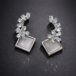 crystal bloom square drop earrings – elegant stone studded statement earrings.