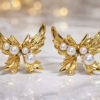 stainless steel gold plated wing pearl earrings